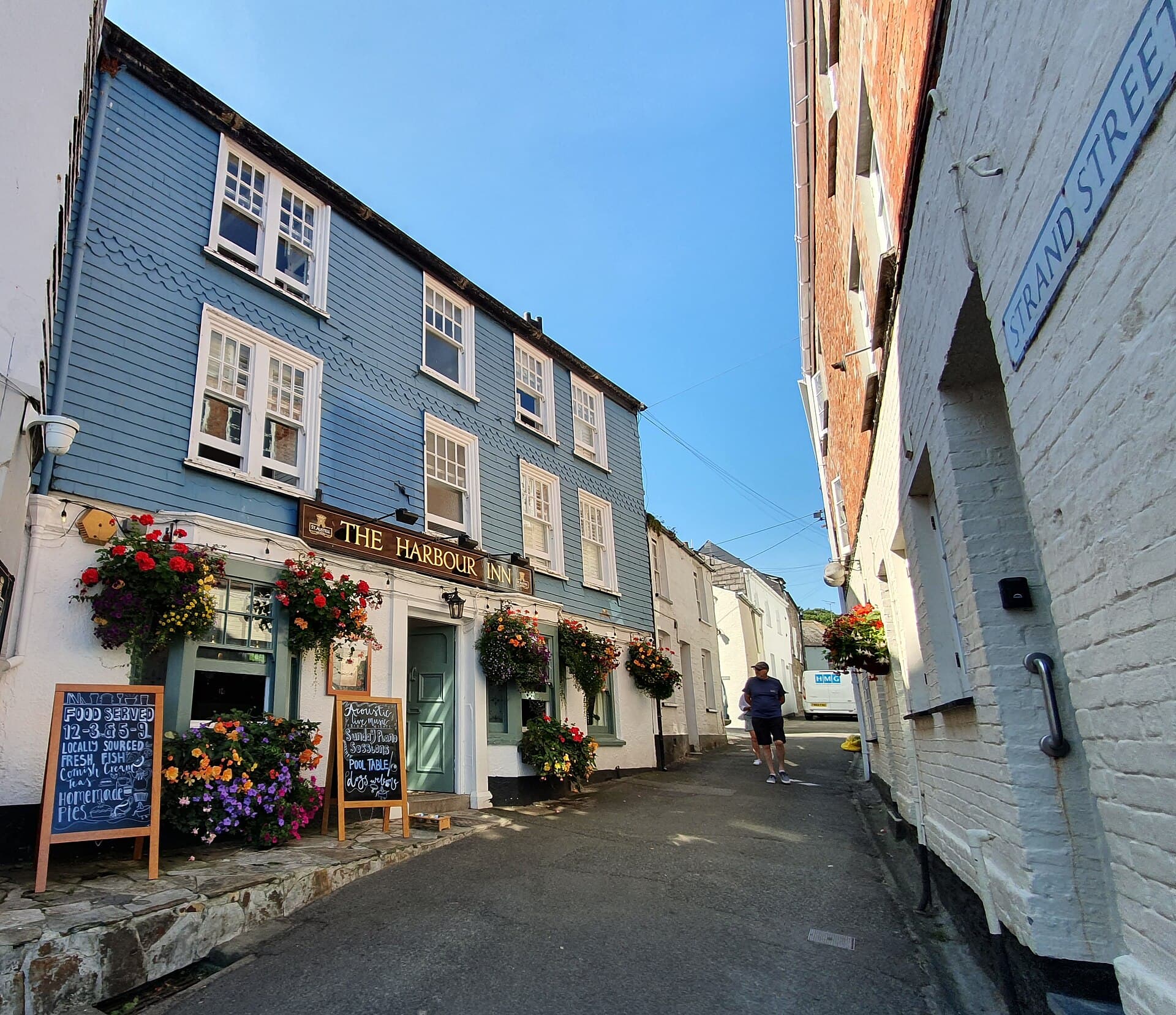 The Harbour Inn and the view up Strand Street, Padstow, Cornwall - August 2022.jpg
